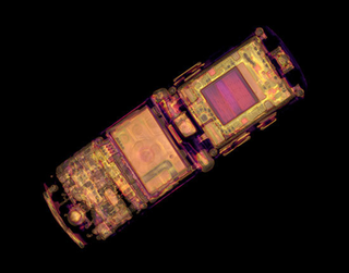 Illustration for article titled CT Scanner Bares Apple Notebook, PS3, and Big Mac to Their Core